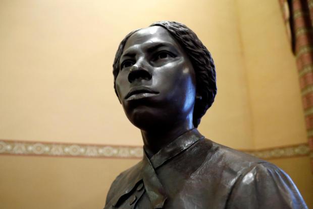 FILE - A bronze statue of abolitionist Harriet Tubman is seen at the Maryland State House, Feb. 10, 2020, in Annapolis. (AP Photo/Julio Cortez, File)