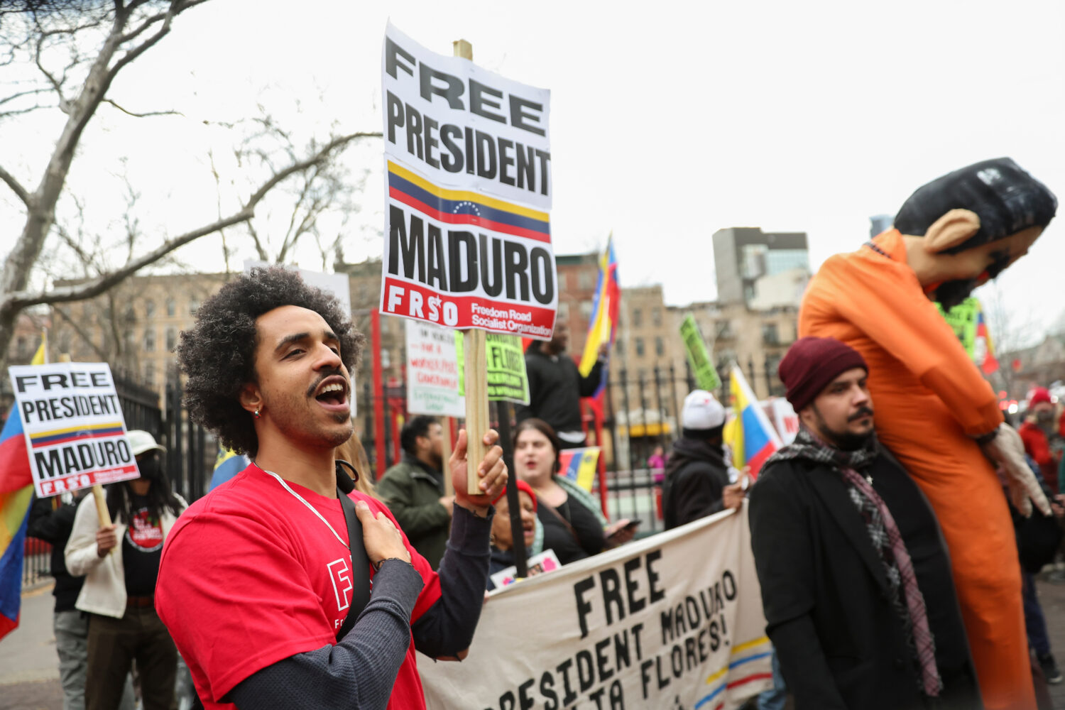 Demonstrators protest outside Manhattan federal court before a pre-trial hearing in former Venezuel...
