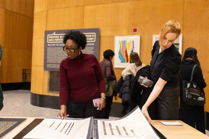 people exploring "printing black america" exhibit at bpl