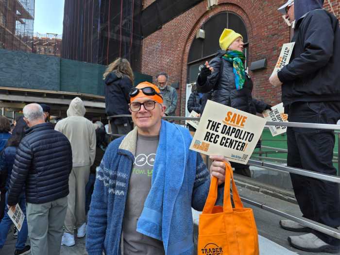 Hank Drombrowski attended Sunday's rally in swimming cap and goggles. Photo by Shane O'Brien