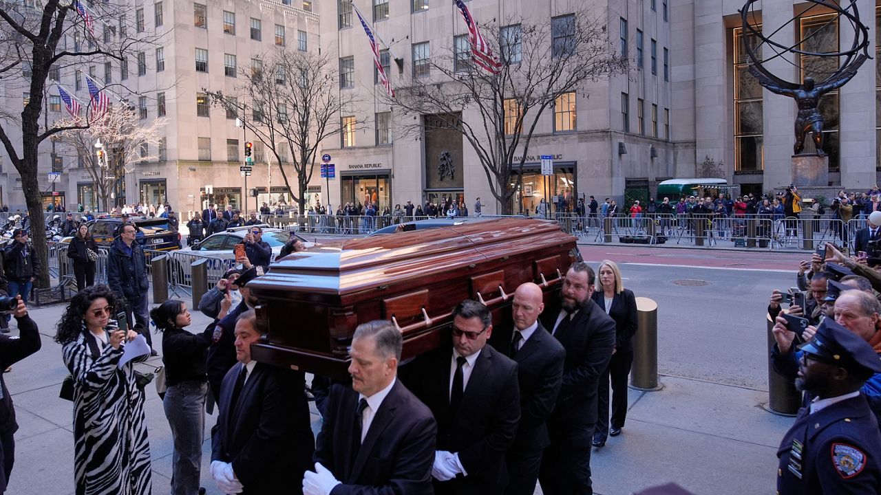 The body of Willie Colon is brought into St. Patrick's Cathedral during his funeral in New York on Monday, March 9, 2026. (AP Photo/Seth Wenig)