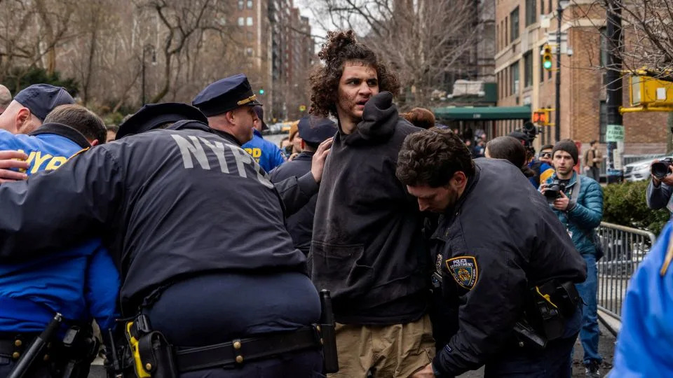 Emir Balat, a high school senior from Pennsylvania, is arrested outside Gracie Mansion on Saturday. - Madison Swart/Reuters