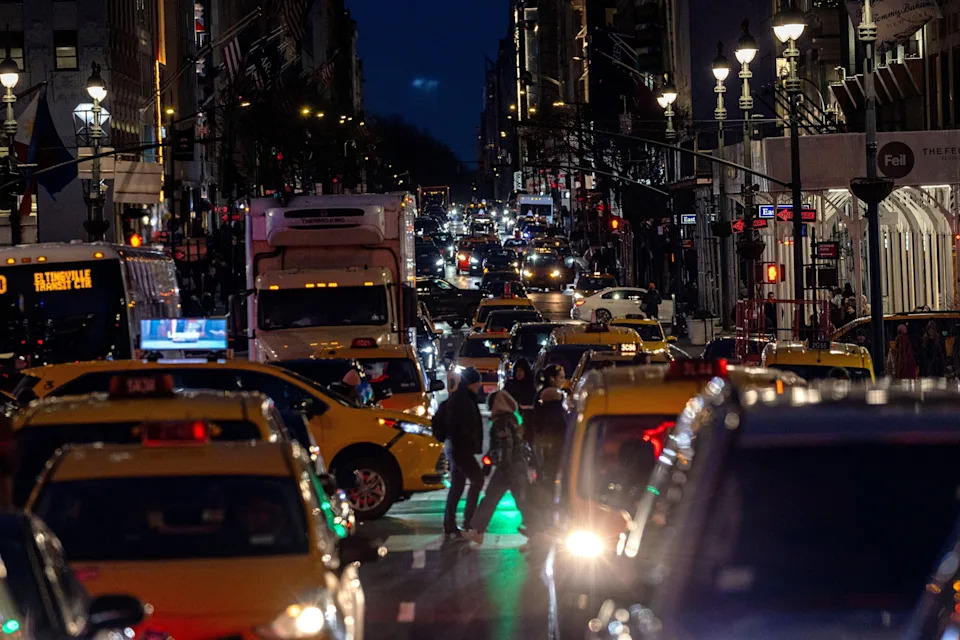 Alex Kent/Getty Images - PHOTO: Traffic moves along midtown Manhattan on Feb. 19, 2025, in New York.