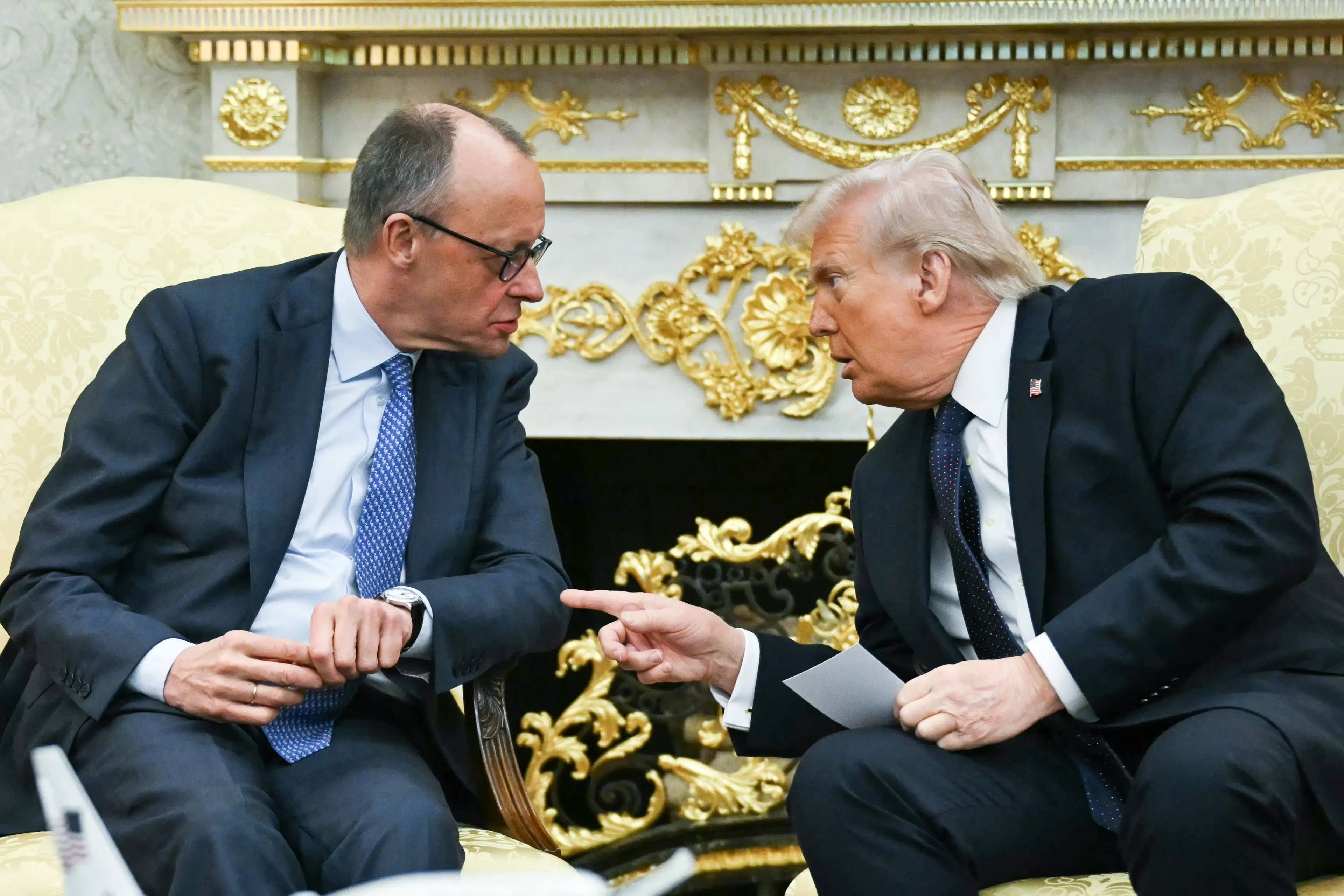 Donald Trump sat alongside German Chancellor Friedrich Merz  (ANDREW CABALLERO-REYNOLDS/AFP via Getty Images)
