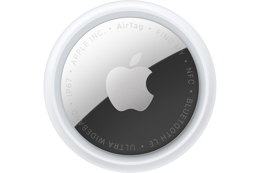 Apple AirTag with a silver metal back featuring the Apple logo and product information.