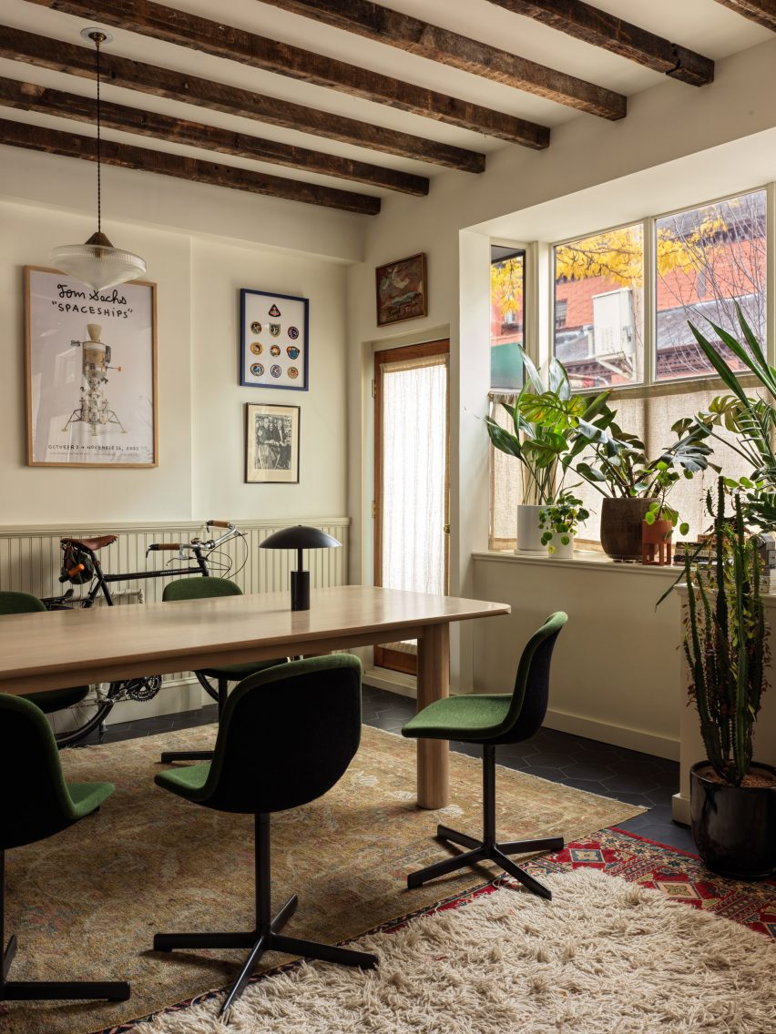 Office with exposed wooden ceiling beams and picture rails