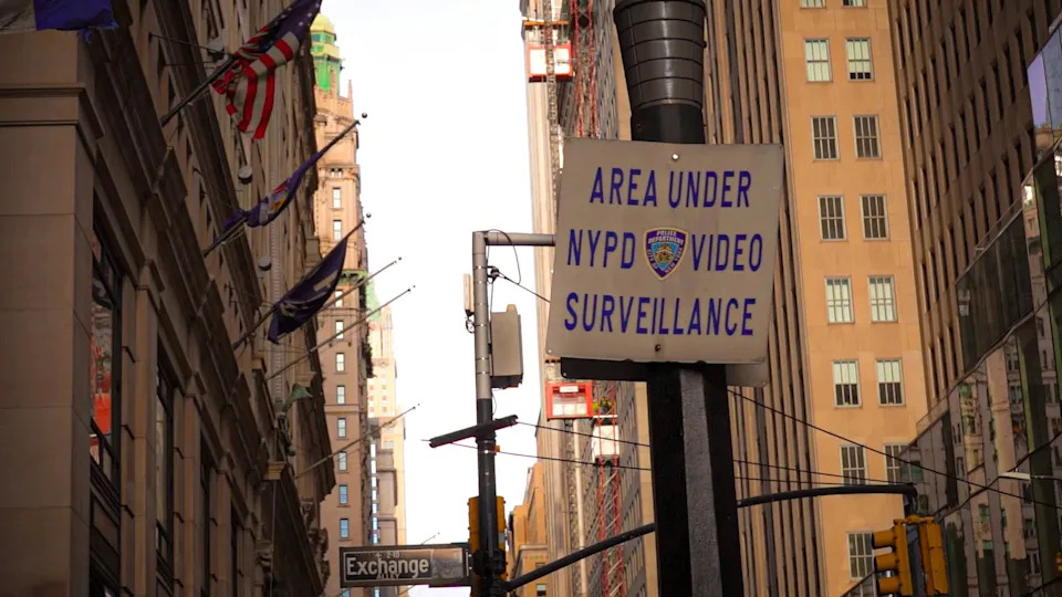 White street sign in New York City with black lettering reading, "AREA UNDER NYPD VIDEO SURVEILLANCE."