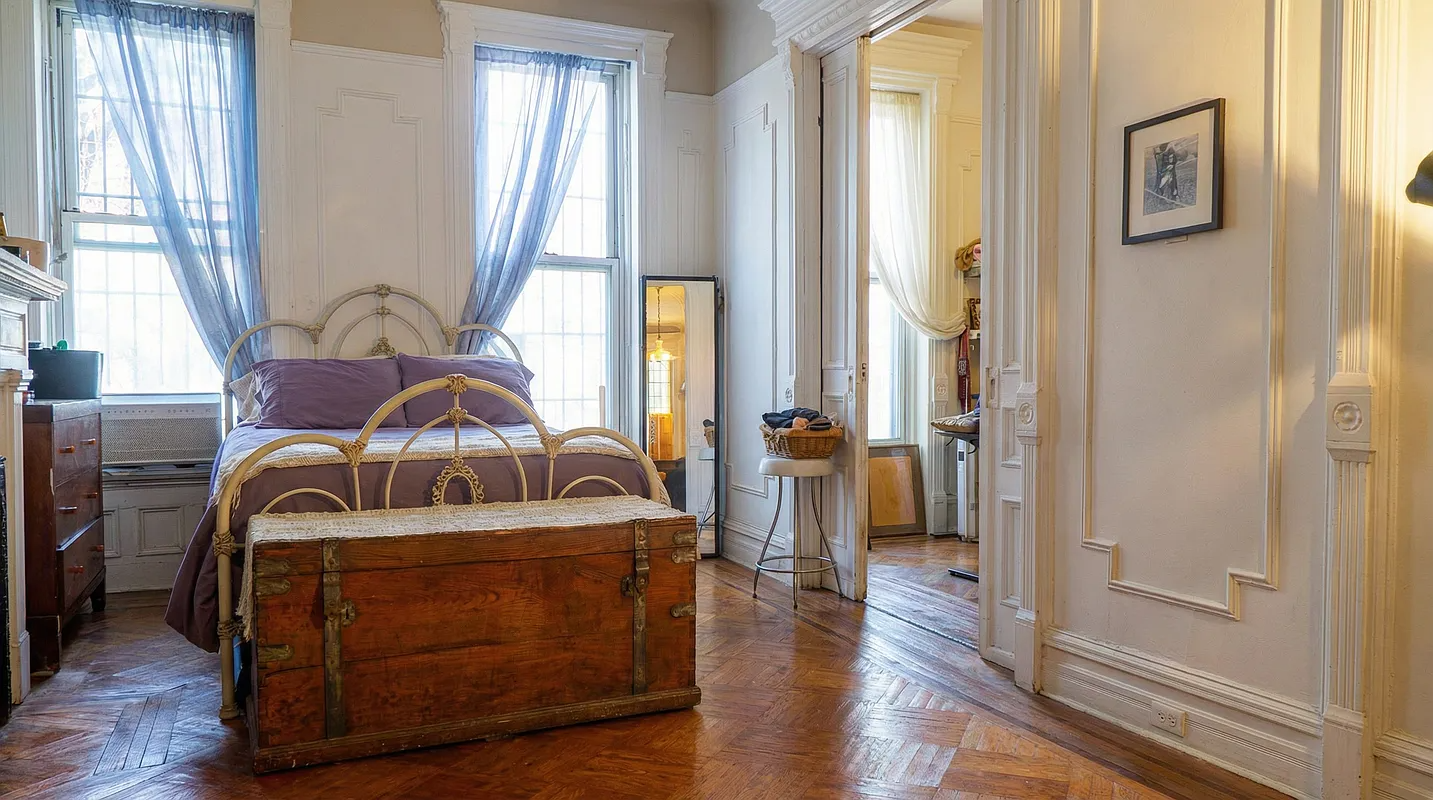 a bedroom with wall moldings