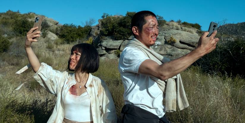 Ali Wong and Steven Yeun as Amy and Danny, bloodied and looking for cell reception in the Season 1 finale of Beef