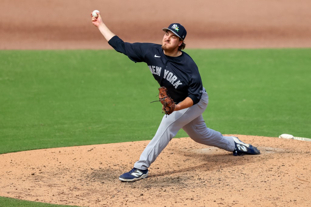 Ben Hess pitching for the New York Yankees.