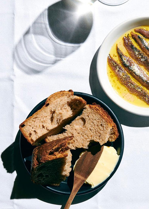 The Four Horsemen's warm house bread is one of the best wine bar snacks in NYC.