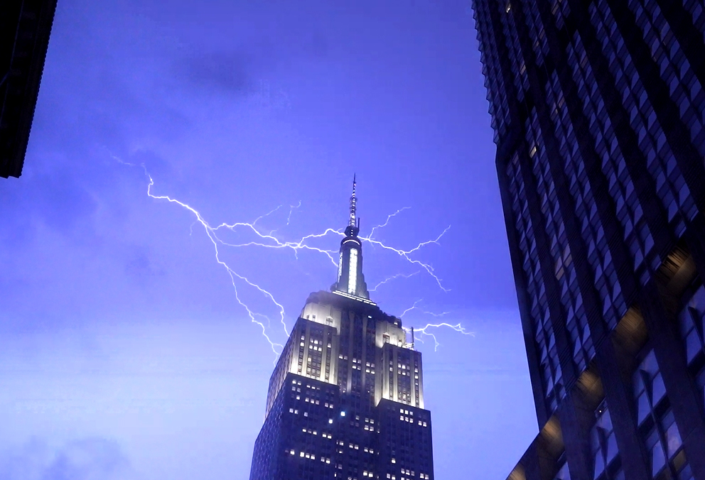 Lightning striking near the Empire State Building during a severe thunderstorm in New York City.