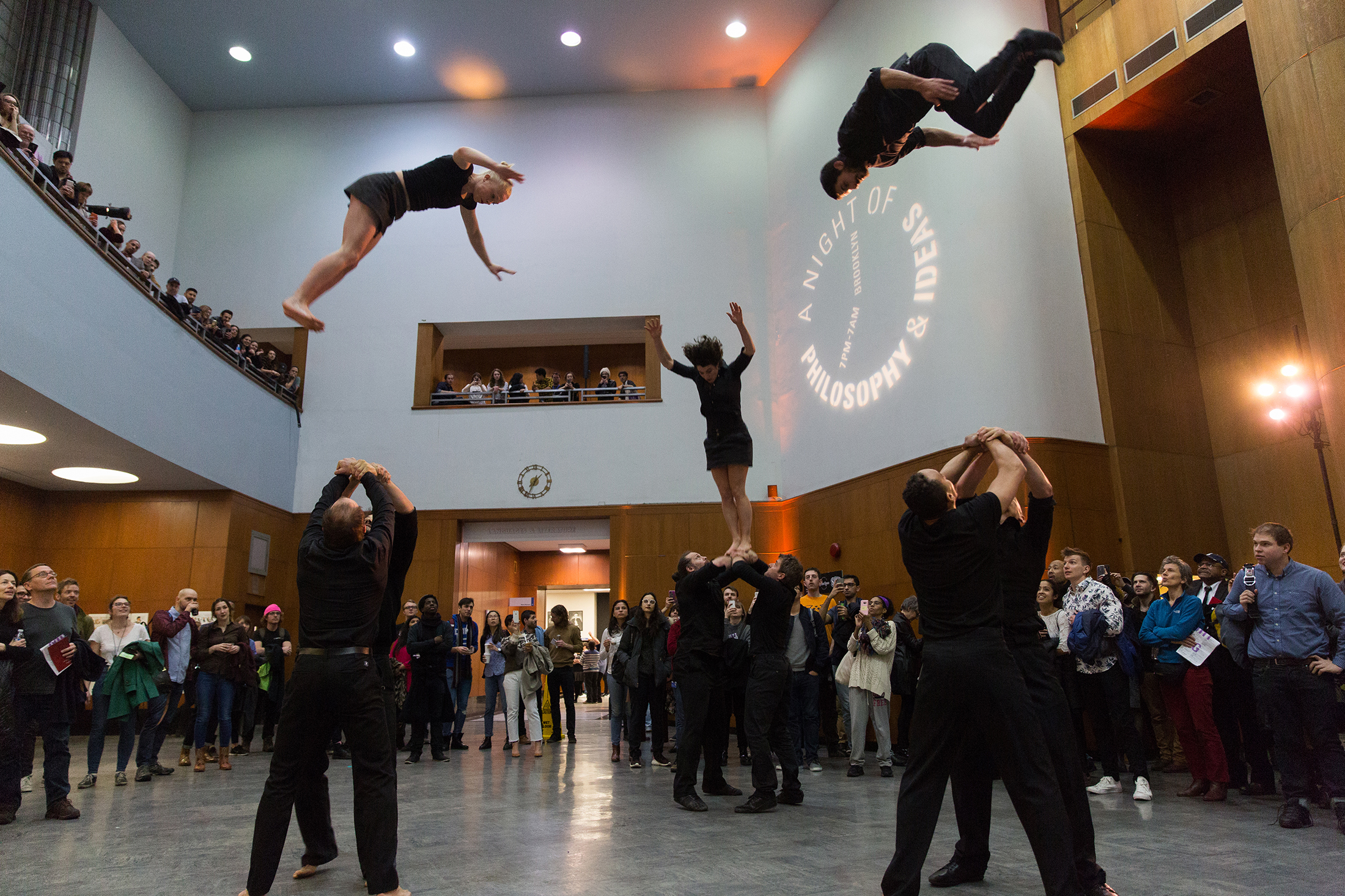 acrobats performing in the central library