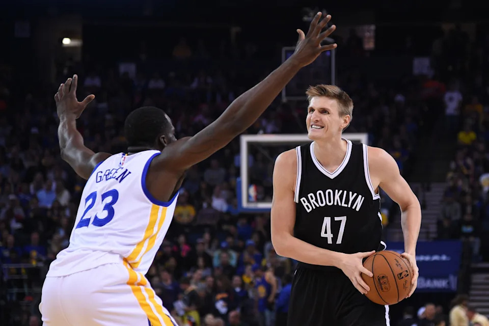 Brooklyn Nets forward Andrei Kirilenko (47) controls the basketball against Golden State Warriors forward Draymond Green (23) during the first quarter at Oracle Arena.