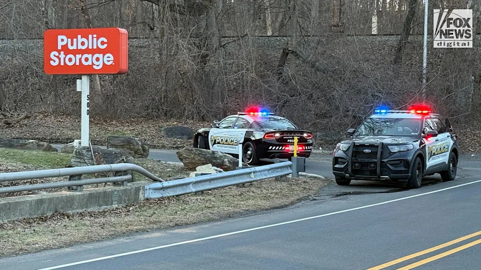 Police cars in front of a storage facility
