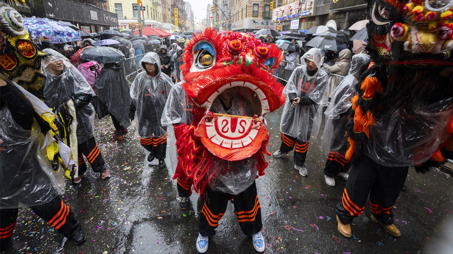 NEW YORK, NEW YORK - FEBRUARY 16: A person wears a ceremonial dragon costume in the 27th annual New York Chinese Lunar New Year parade celebrating the year of the snake during a rainstorm on February 16, 2025 in Chinatown, New York City. (Photo by Craig T Fruchtman/Getty Images)
