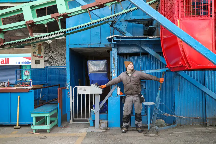 man operating the wonder wheel