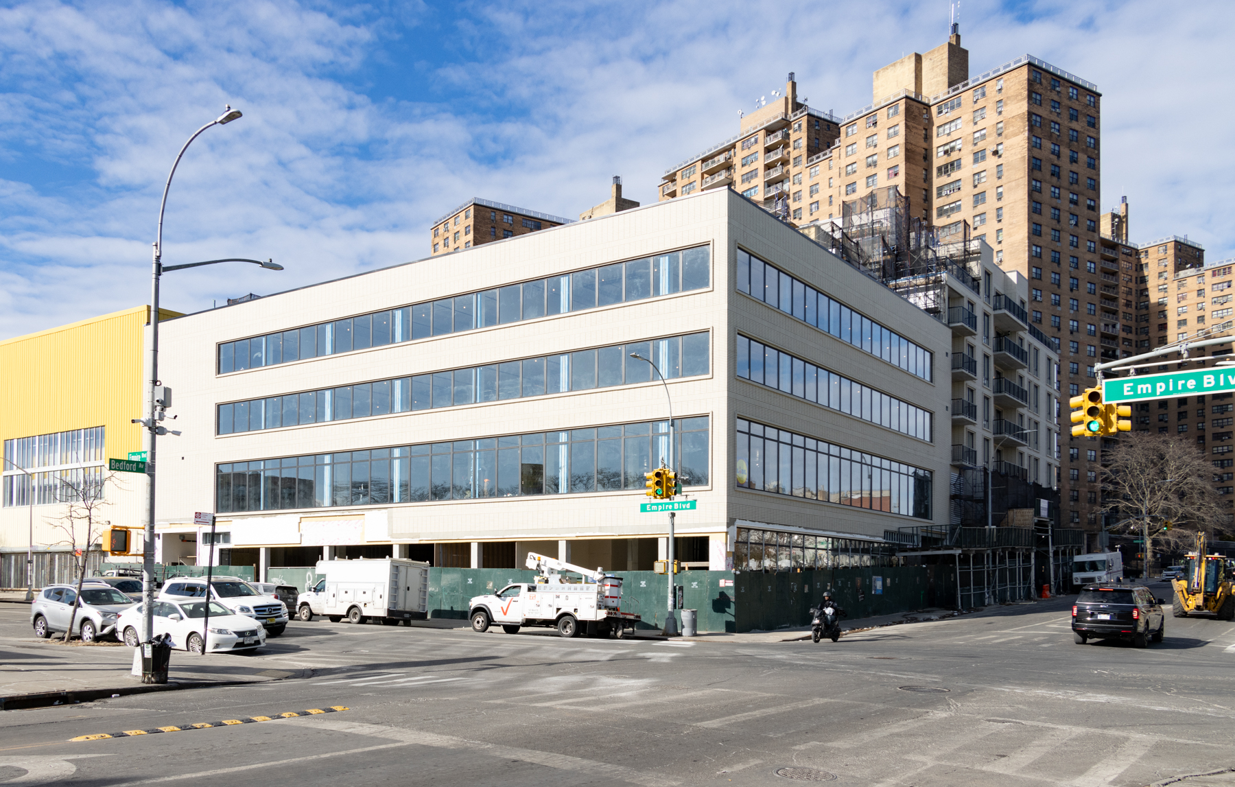 crown heights - construction fence around a commercial building