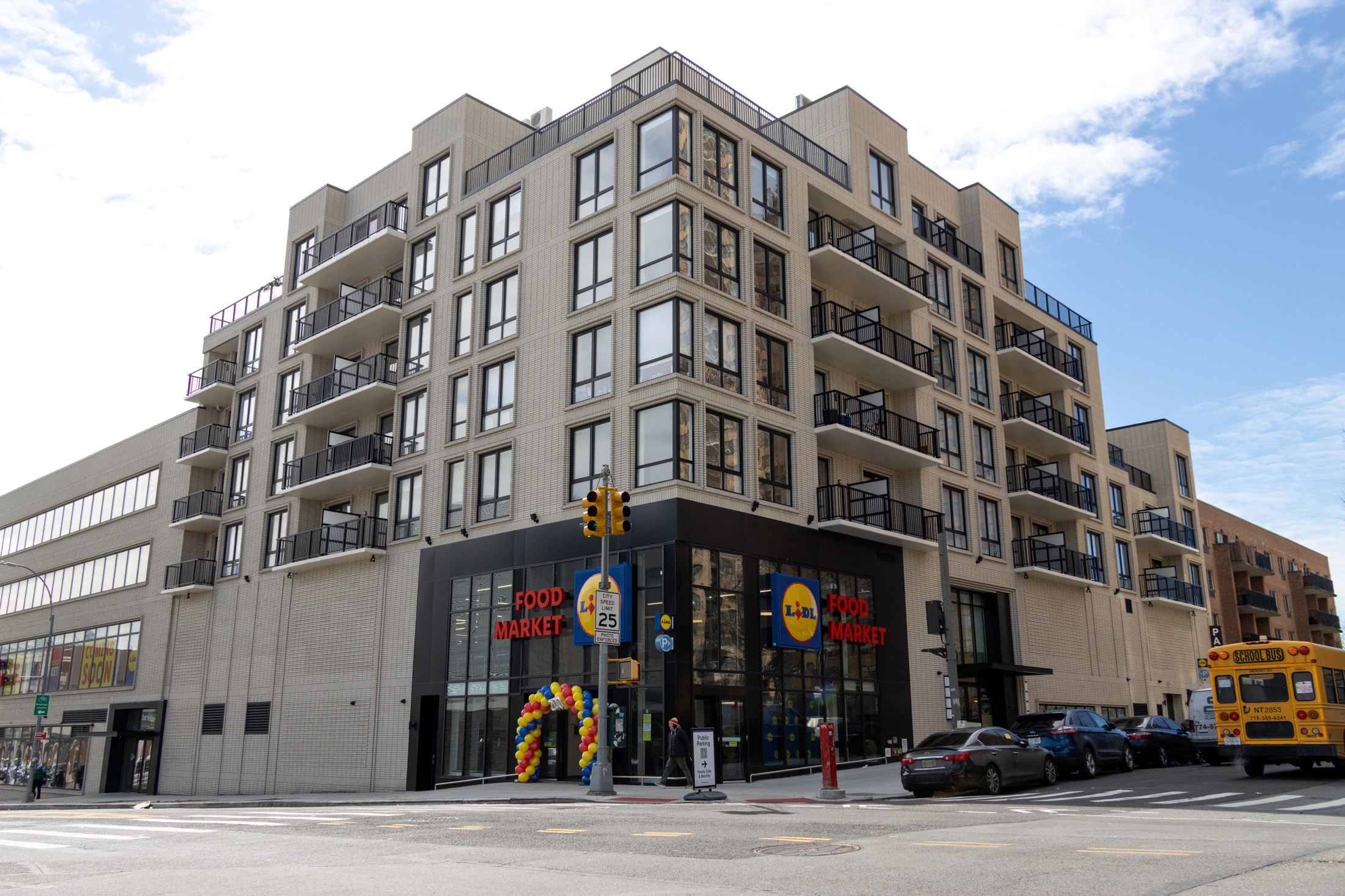 brick building with grocery story at the base