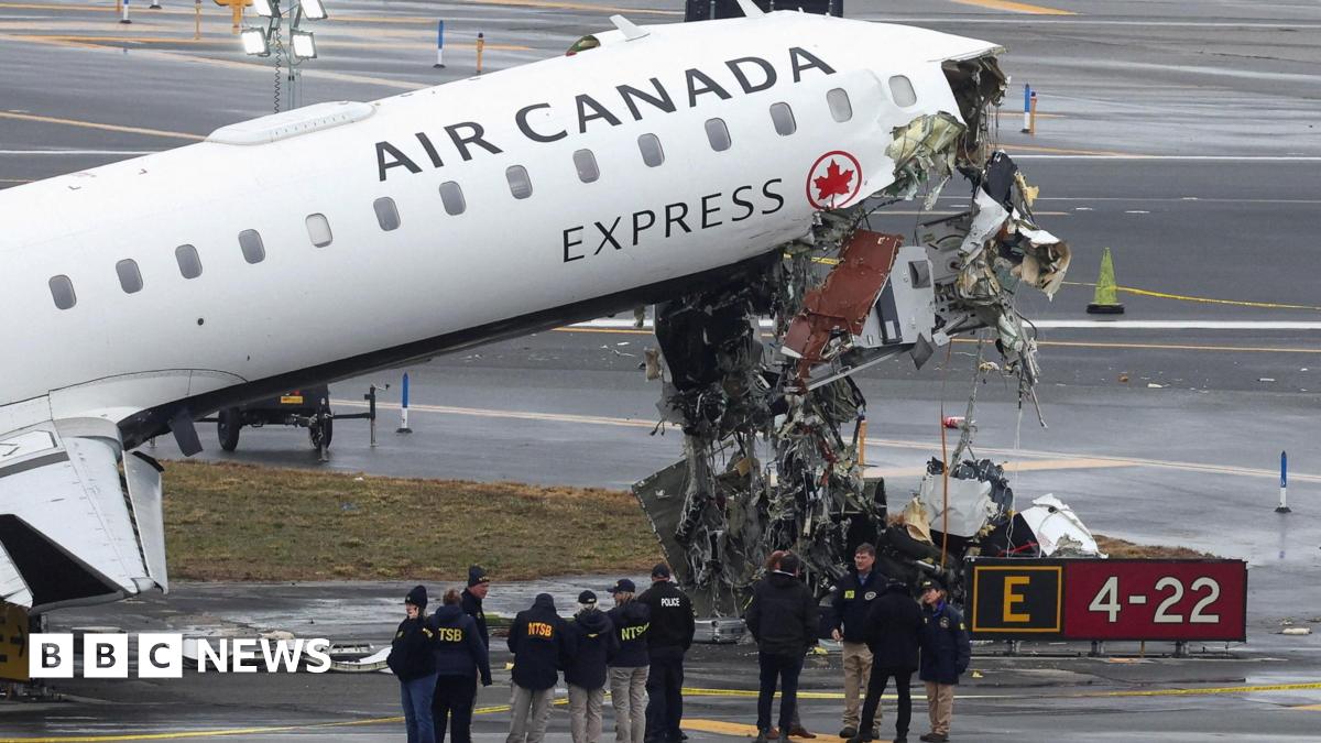 LaGuardia: Two pilots killed and New York airport closed after plane hits fire truck