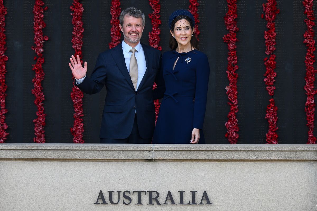 Queen Mary of Denmark and King Frederik X of Denmark posing for photographs at the Roll of Honour during a visit to the Australian War Memorial