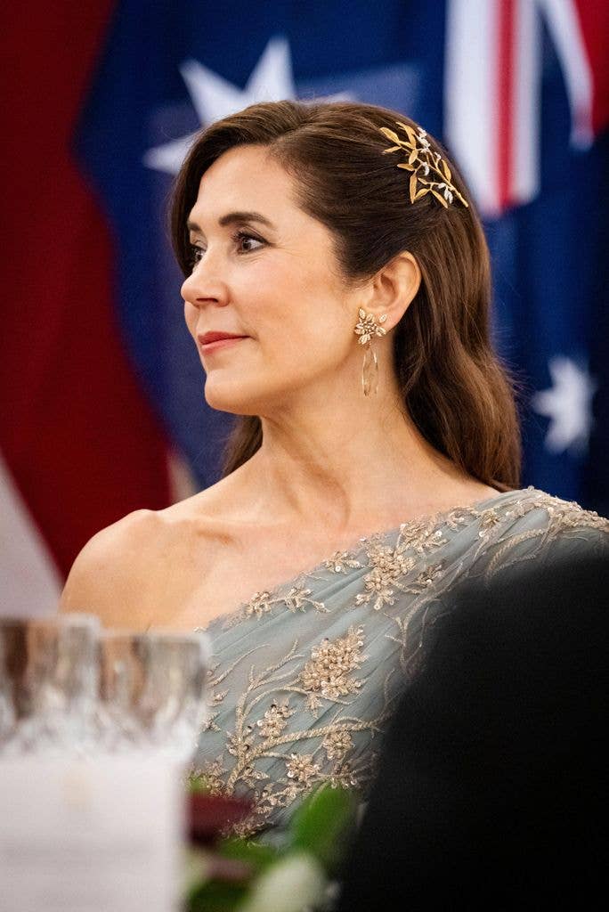 Queen Mary side on sat down in gown