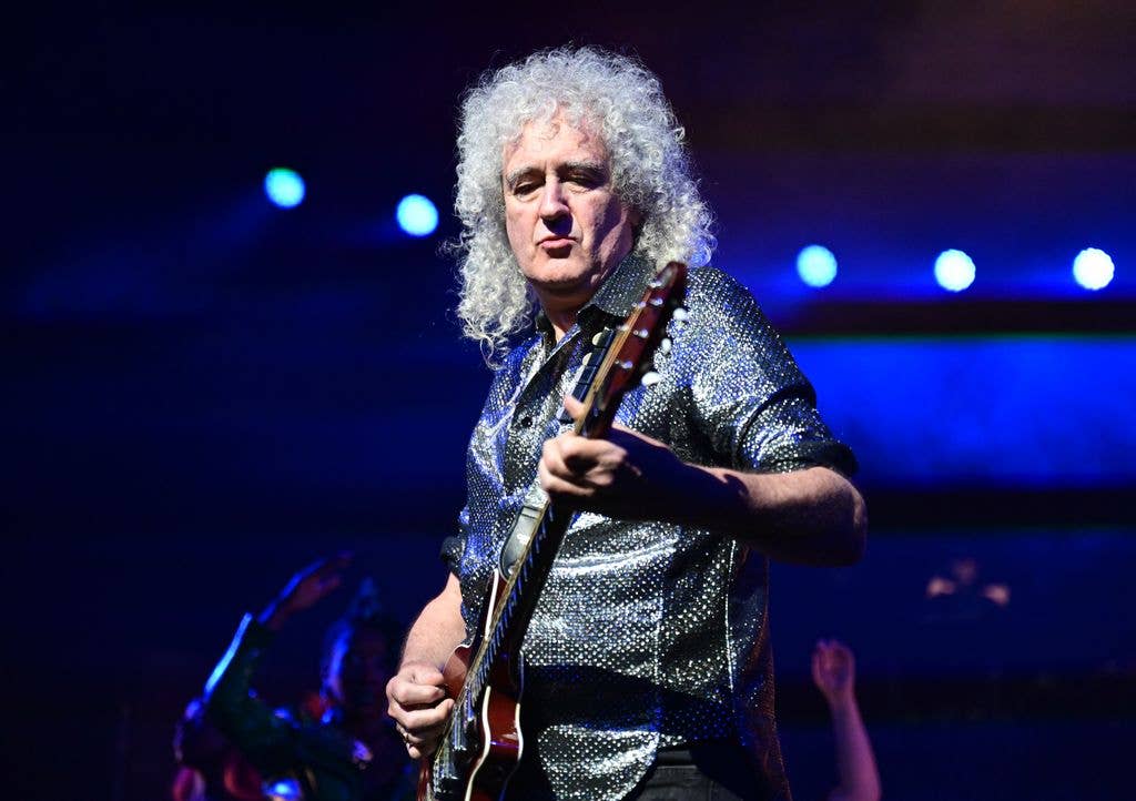 Brian May performing in 2025