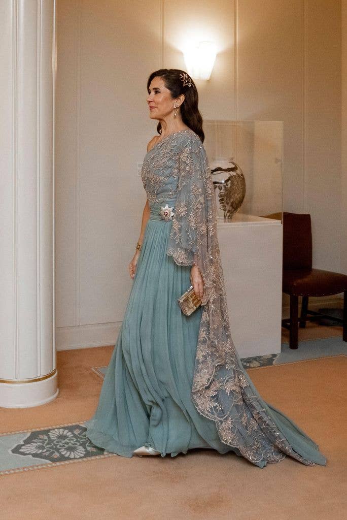  Queen Mary side on in blue embellished gown