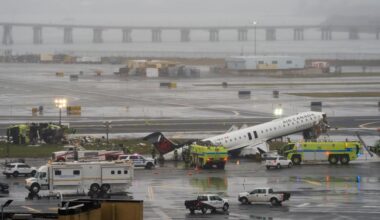 Flight attendant found buckled into seat outside plane after LaGuardia crash, reports say