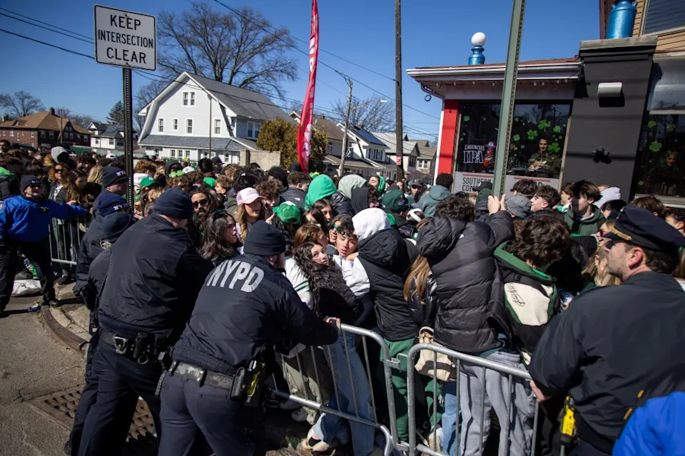 Police hold stop barricades from being turned over as spectators get caught in a bottleneck along the route during the Staten Island St. Patrick’s Day Parade on March 02, 2025. Michael Nagle