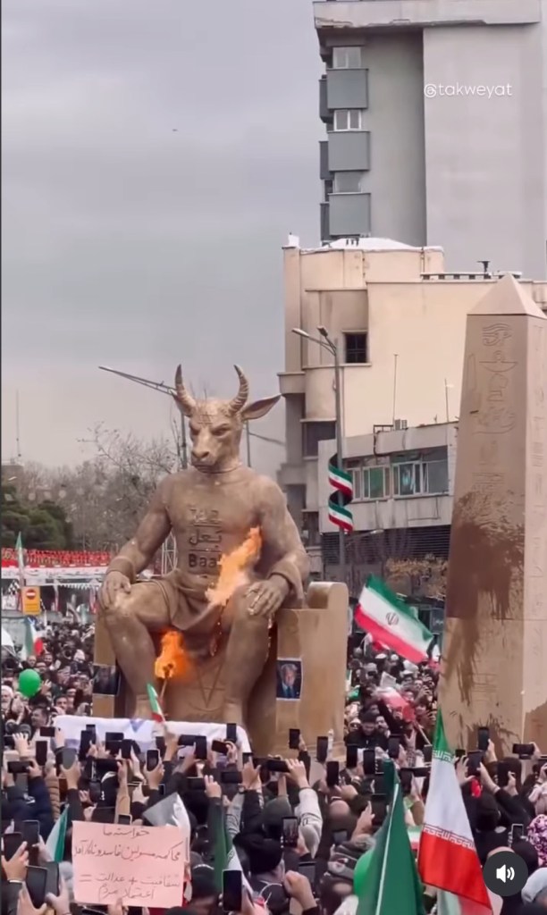 An effigy of the mythical figure Baal with a Star of David on its forehead and a picture of President Trump attached to it is burned in Tehran earlier this year.