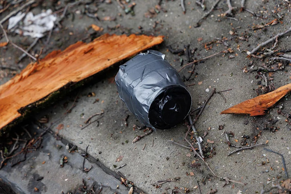 A homemade explosive device is seen on the ground after a left-wing protester throws the device at a demonstration held by far-right influencer Jake Lang outside Gracie Mansion in New York City, United States, on March 7, 2025. / Credit: Matthew Hoen/NurPhoto via Getty Images