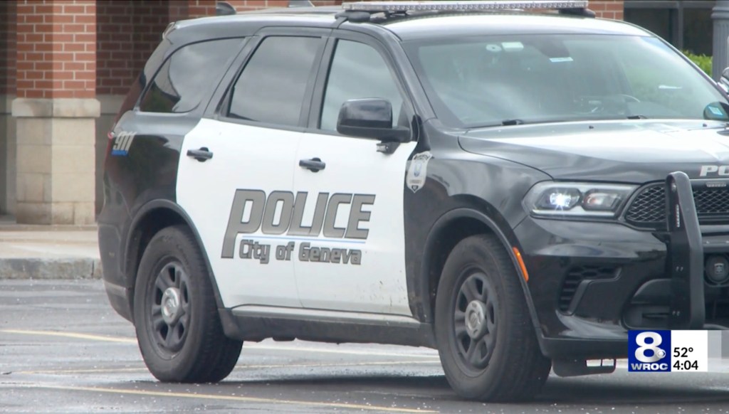 A black and white Geneva police vehicle with a "POLICE City of Geneva" decal on its side.