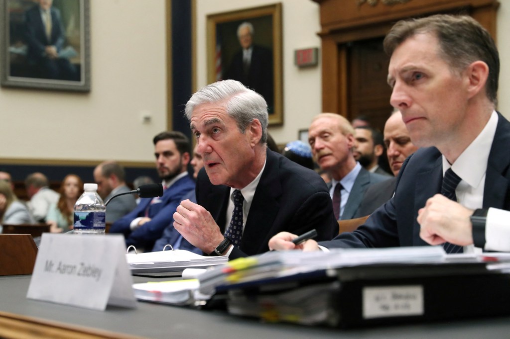 Former Special Counsel Robert Mueller testifies at a House Intelligence Committee hearing, with prosecutor Aaron Zebley beside him.