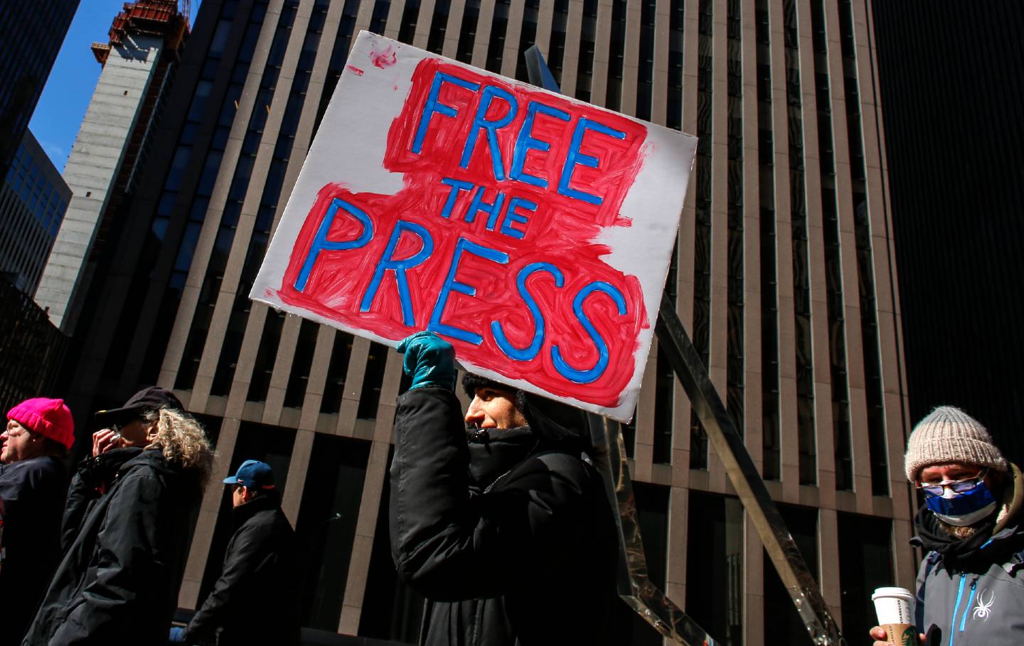 People take part in a protest outside the New York Times Building on February 26, 2017, in New York.