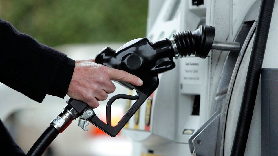 A Shell gas station customer pumps gas in Menlo Park, Calif. (AP Photo/Paul Sakuma)
