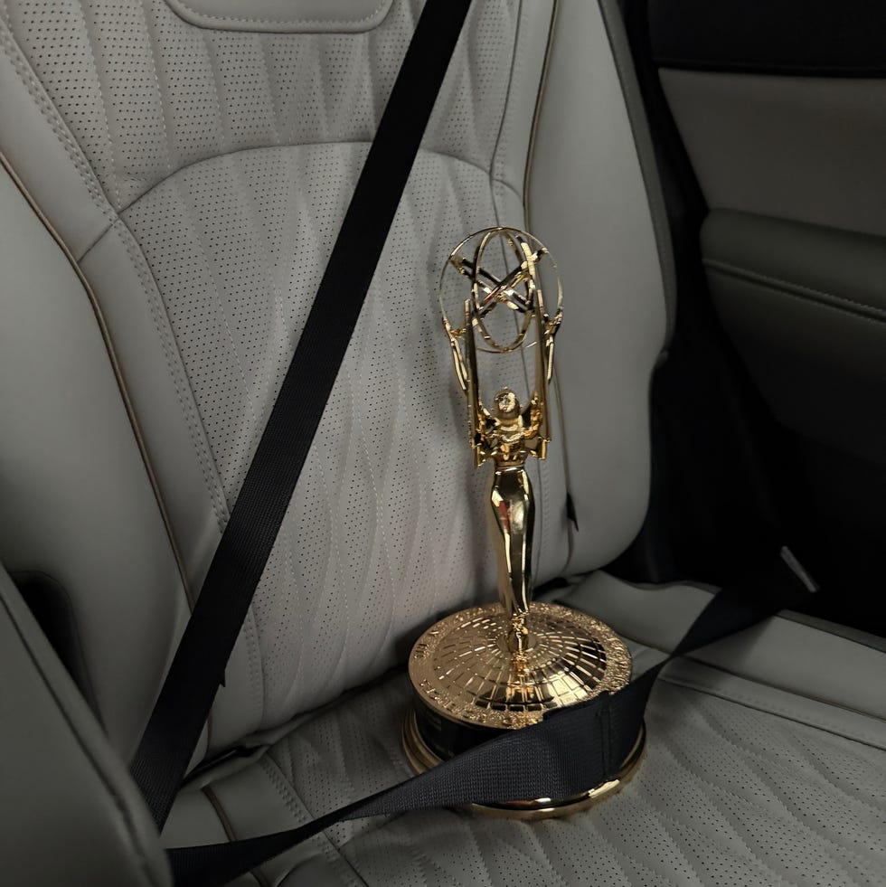 an award secured with a seat belt in a car