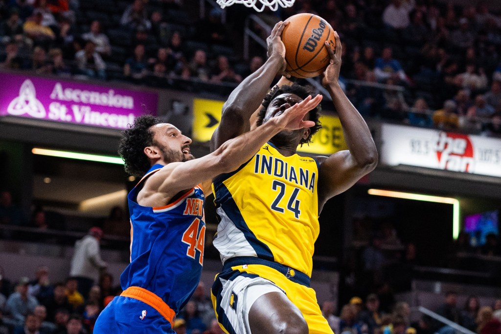 Indiana Pacers forward Kobe Brown (24) shoots the ball while New York Knicks guard Landry Shamet (44) defends.