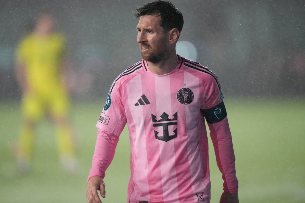 Lionel Messi in a pink Inter Miami jersey.