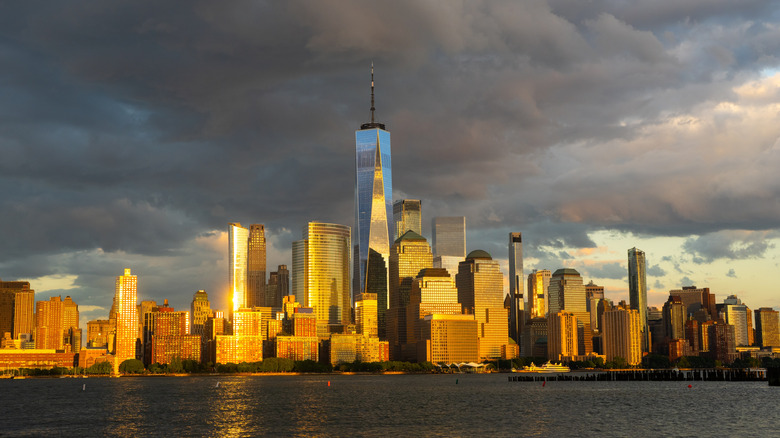 Skyline of New York City at sunset from water.