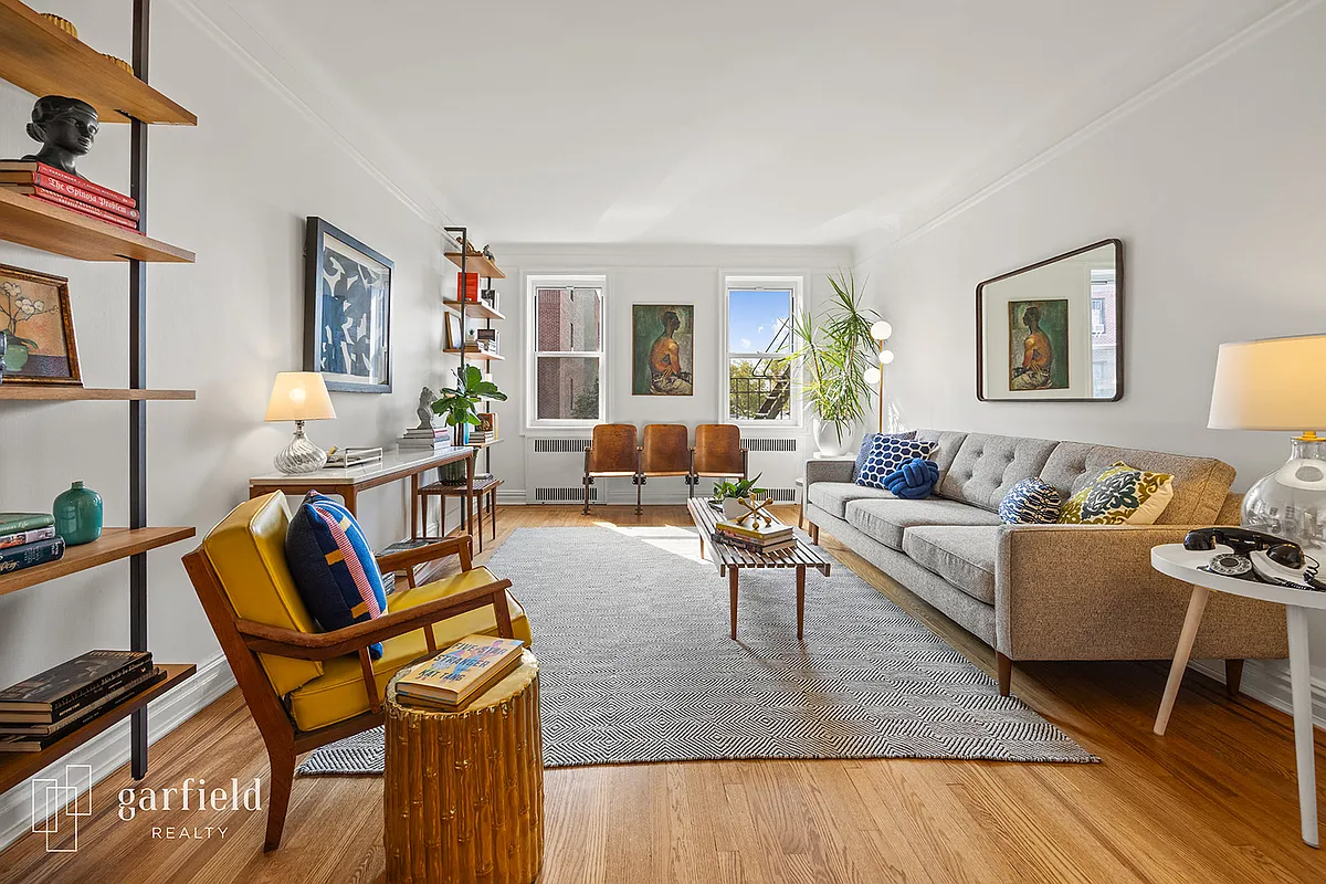 living room with wood floors, white walls