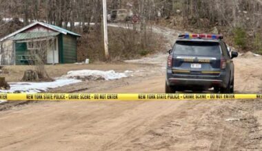 New York State Police say they found two people dead inside separate burned cars before troopers shot and killed an armed suspect in Lewis County on Friday.