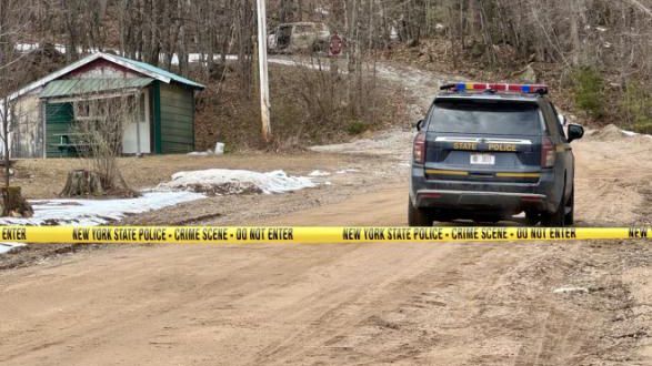 New York State Police say they found two people dead inside separate burned cars before troopers shot and killed an armed suspect in Lewis County on Friday.