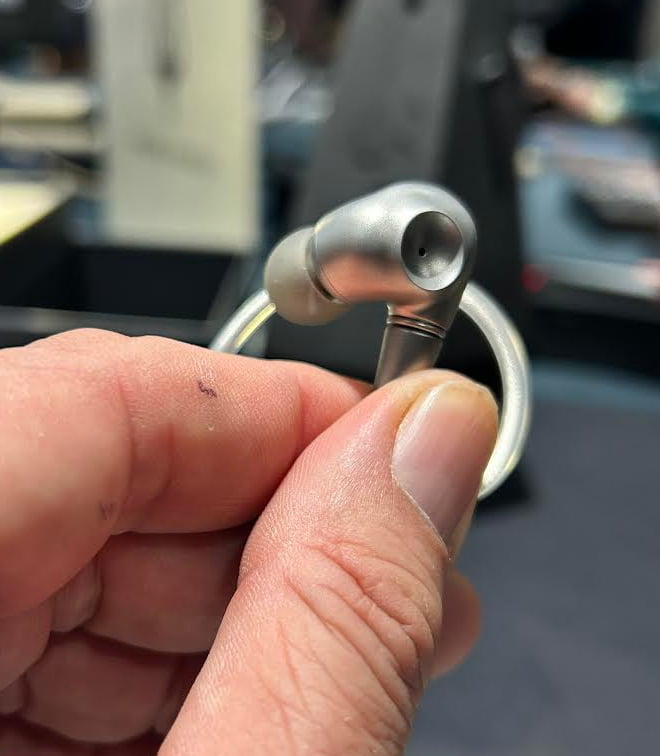 Meze Audio Astru IEM in hand at CanJam NYC 2026