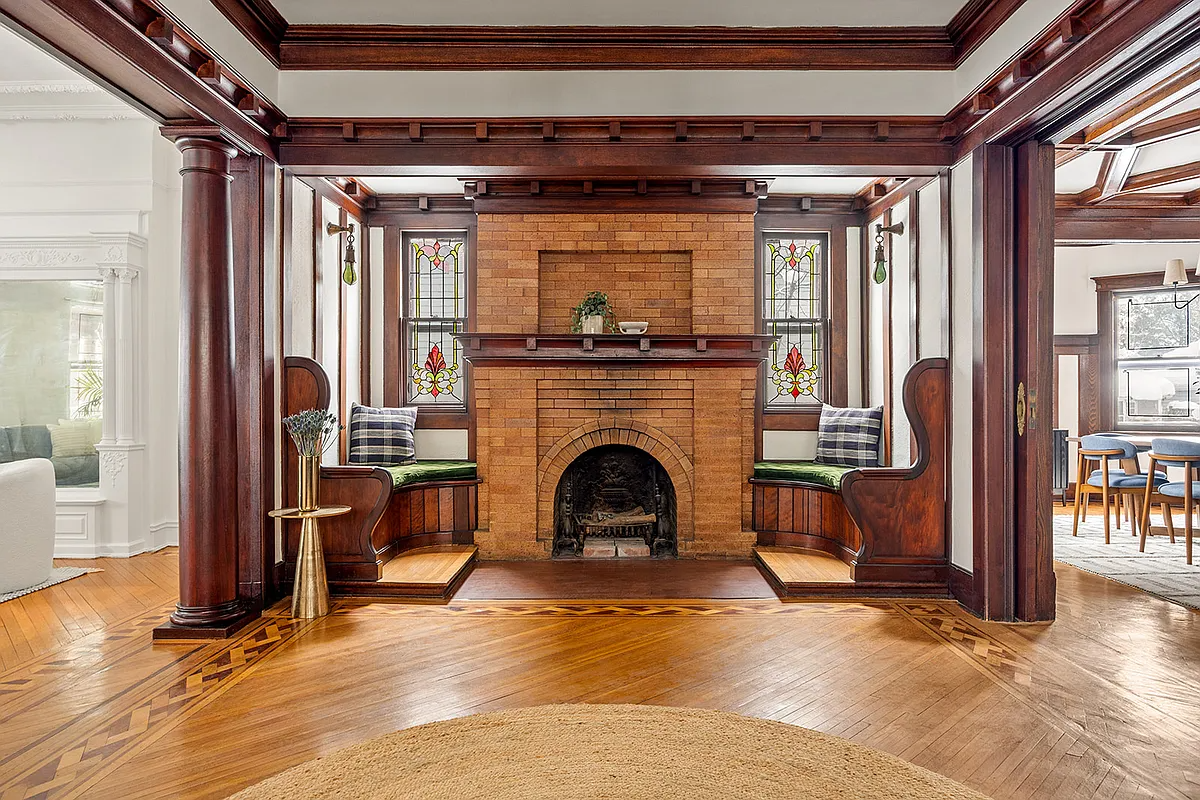 entry hall with an inglenook with a fireplace and benches on either side
