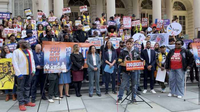 group of people on the steps of a building