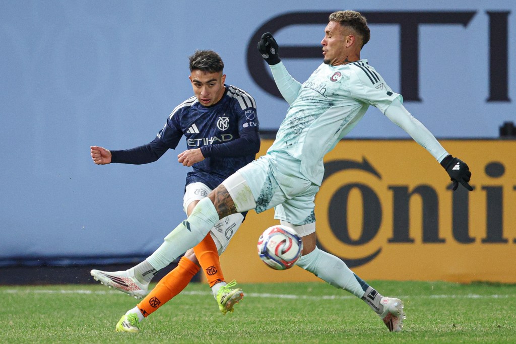 New York City FC forward Agustin Ojeda kicks the ball against Colorado Rapids forward Rafael Navarro during the second half at Yankee Stadium.