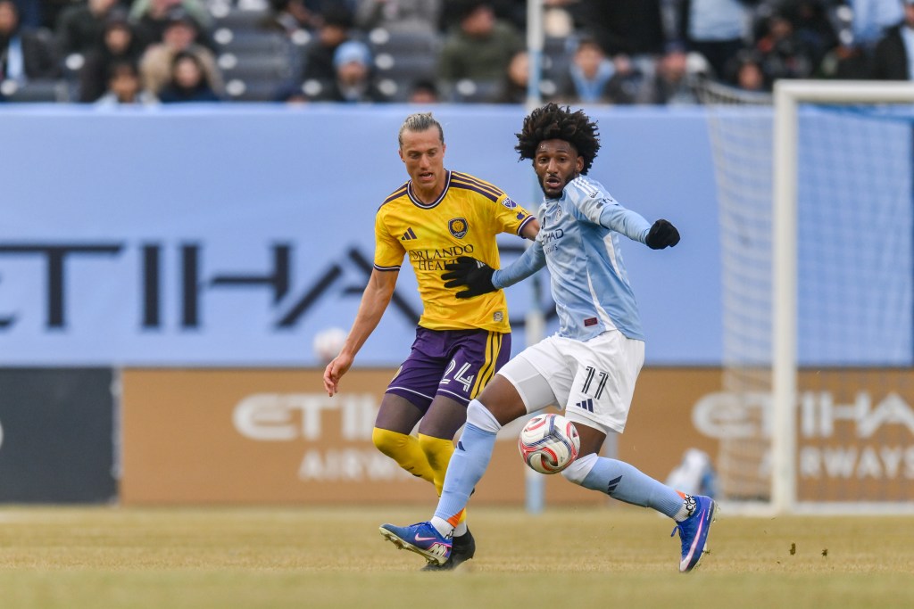 New York City FC forward Talles Magno (11) tries to control the ball as Orlando City midfielder Griffin Dorsey (24) defends.