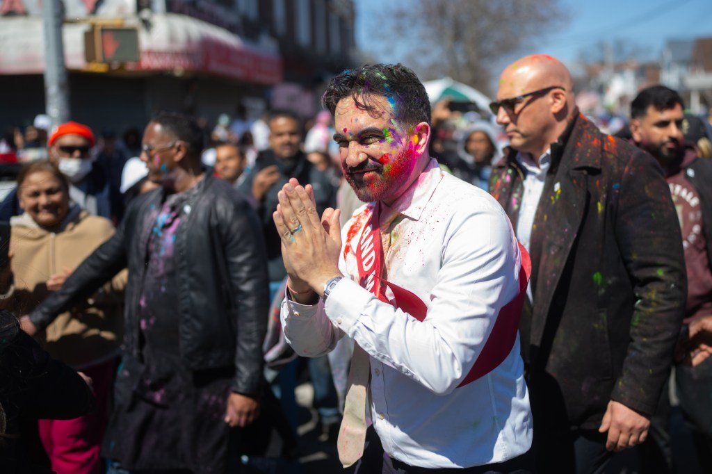 New York City Mayor Zohran Mamdani with color powder on his face and clothes, during the 38th Annual Phagwah (Holi) Parade.