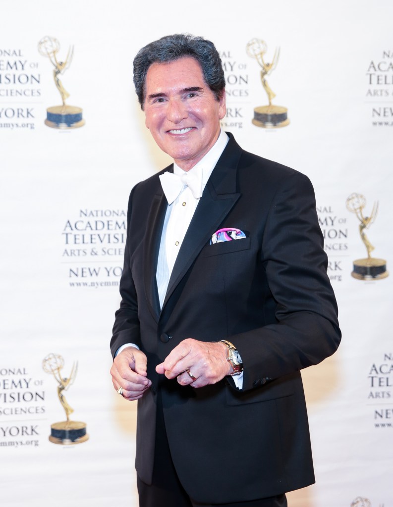 News anchor Ernie Anastos smiling in a tuxedo with a white bow tie.